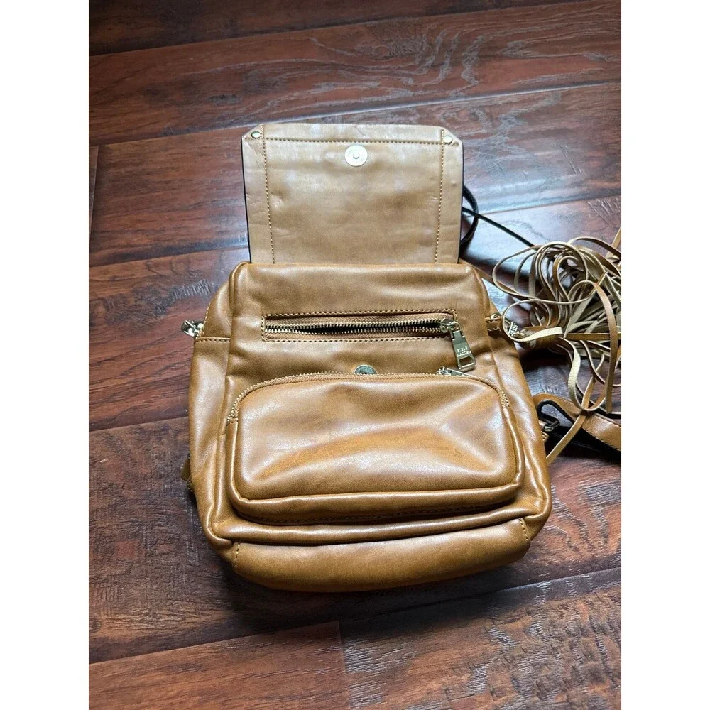 Steve Madden camel-colored Tampa backpack featuring a tassel detail